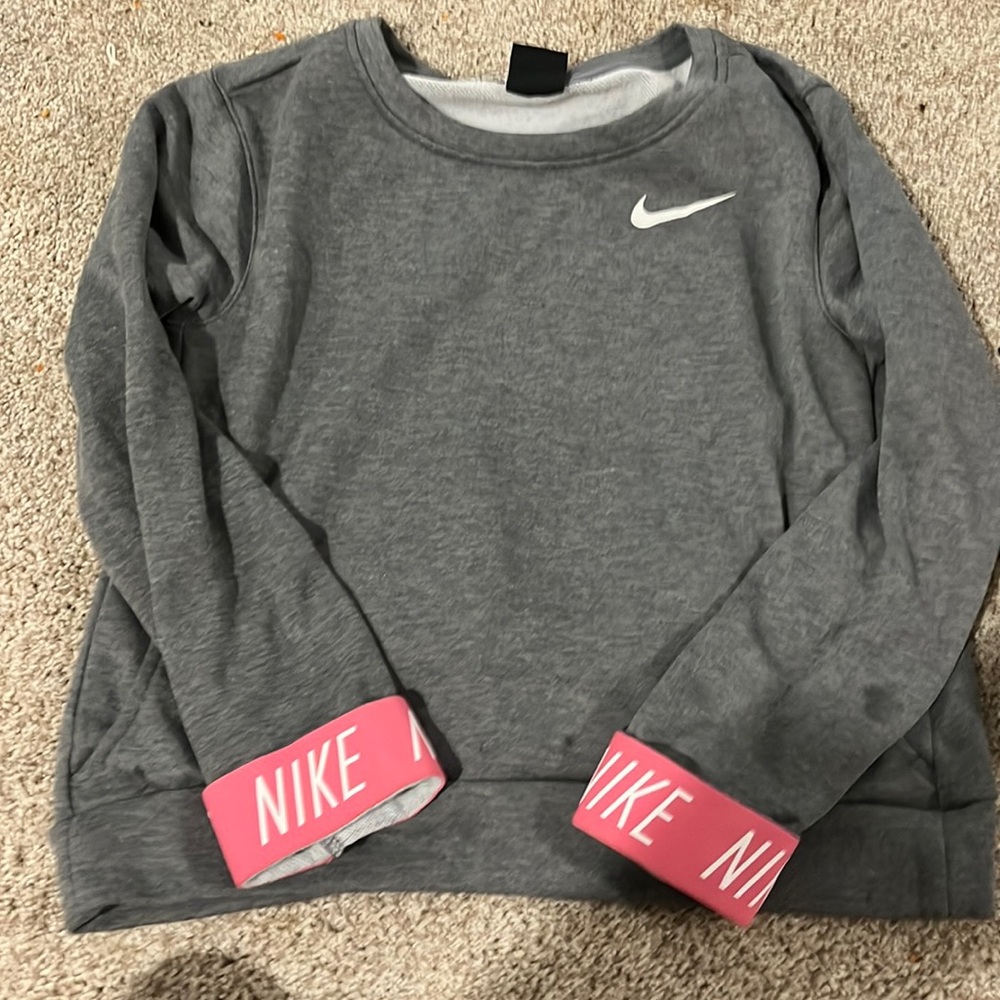 Youth large Nike sweatshirt with hot pink cuff